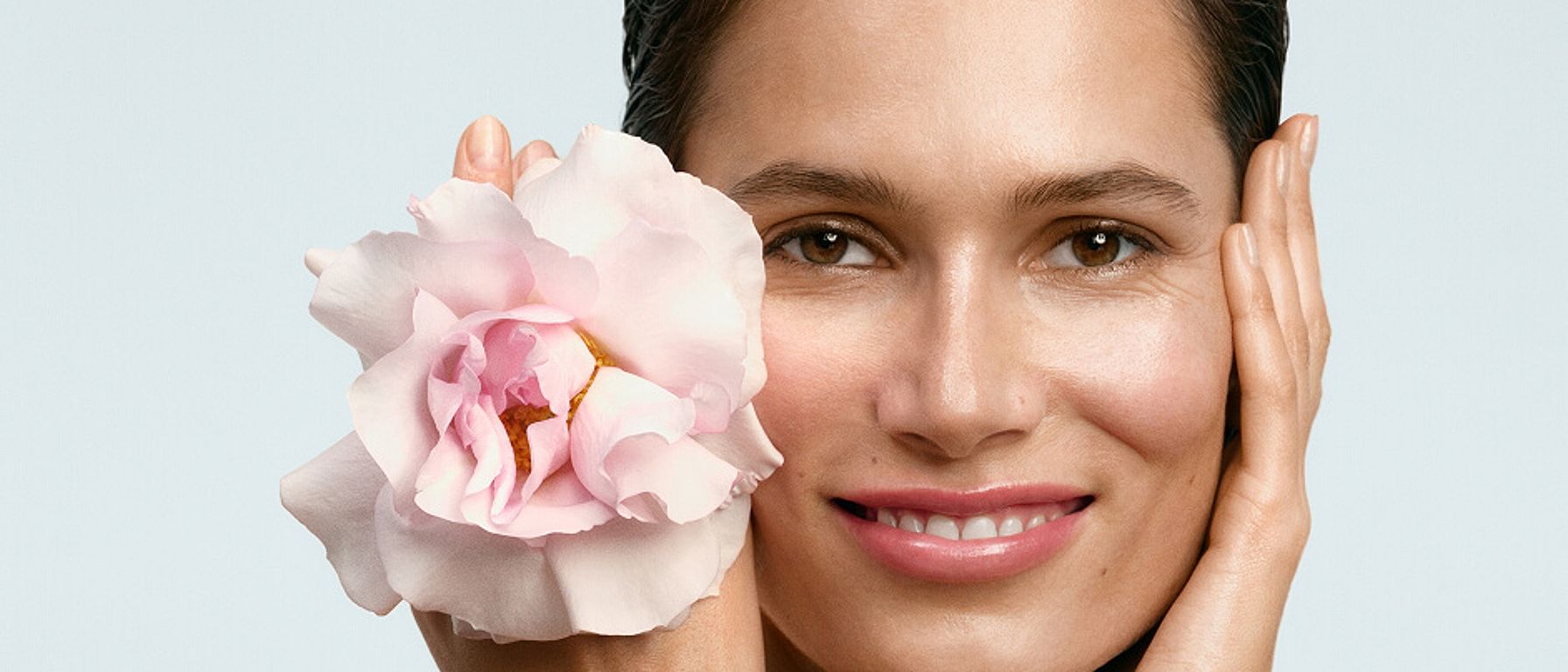 woman washing her face